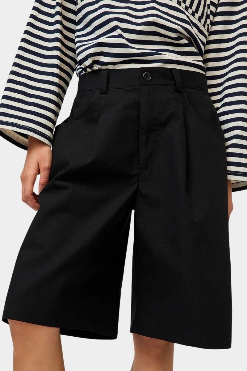 No.6 Mick Short in black cotton ripstop bermuda shorts front view showing button closure and pleated front
