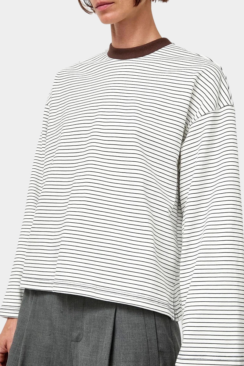 No.6 Nora Top in White Stripe, angled front view showing the brown crew neck and wide sleeve at YUCCA Denver