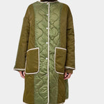 No.6 Summit Jacket in Olive, front view showing the quilted coat over a turtleneck