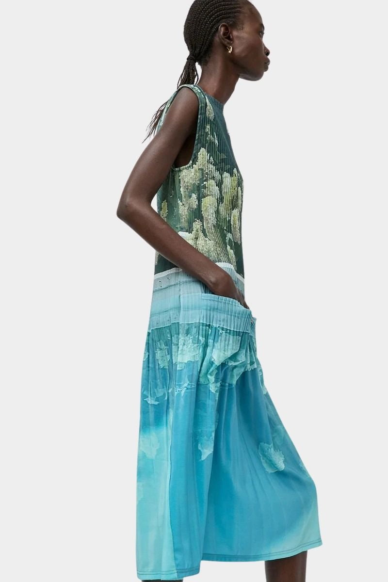 No.6 Tierney Dress Bellport Blue side profile with fluid pleated skirt and floral print
