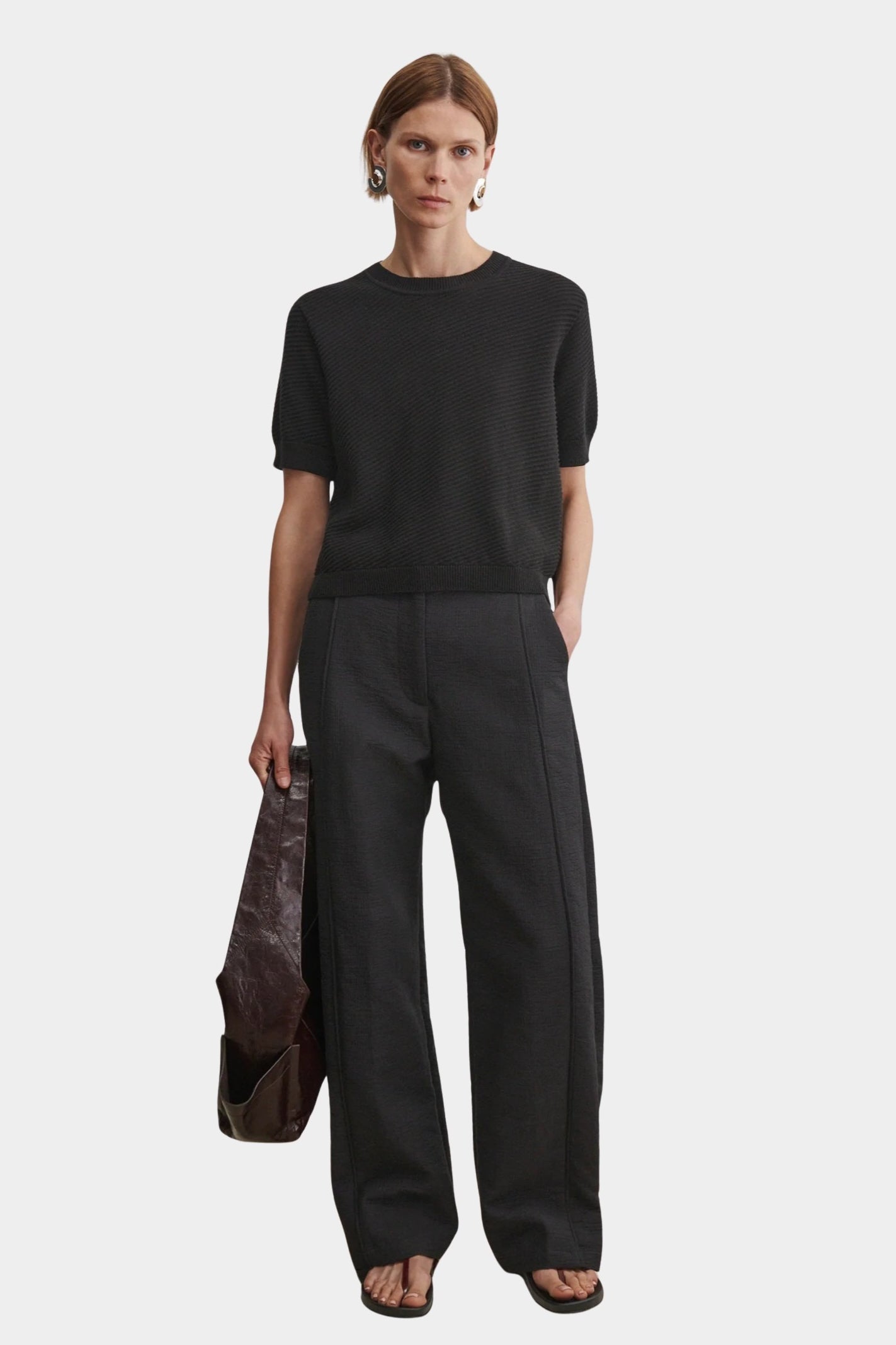Rachel Comey Calibra Top Black styled with relaxed trousers and minimalist summer layering