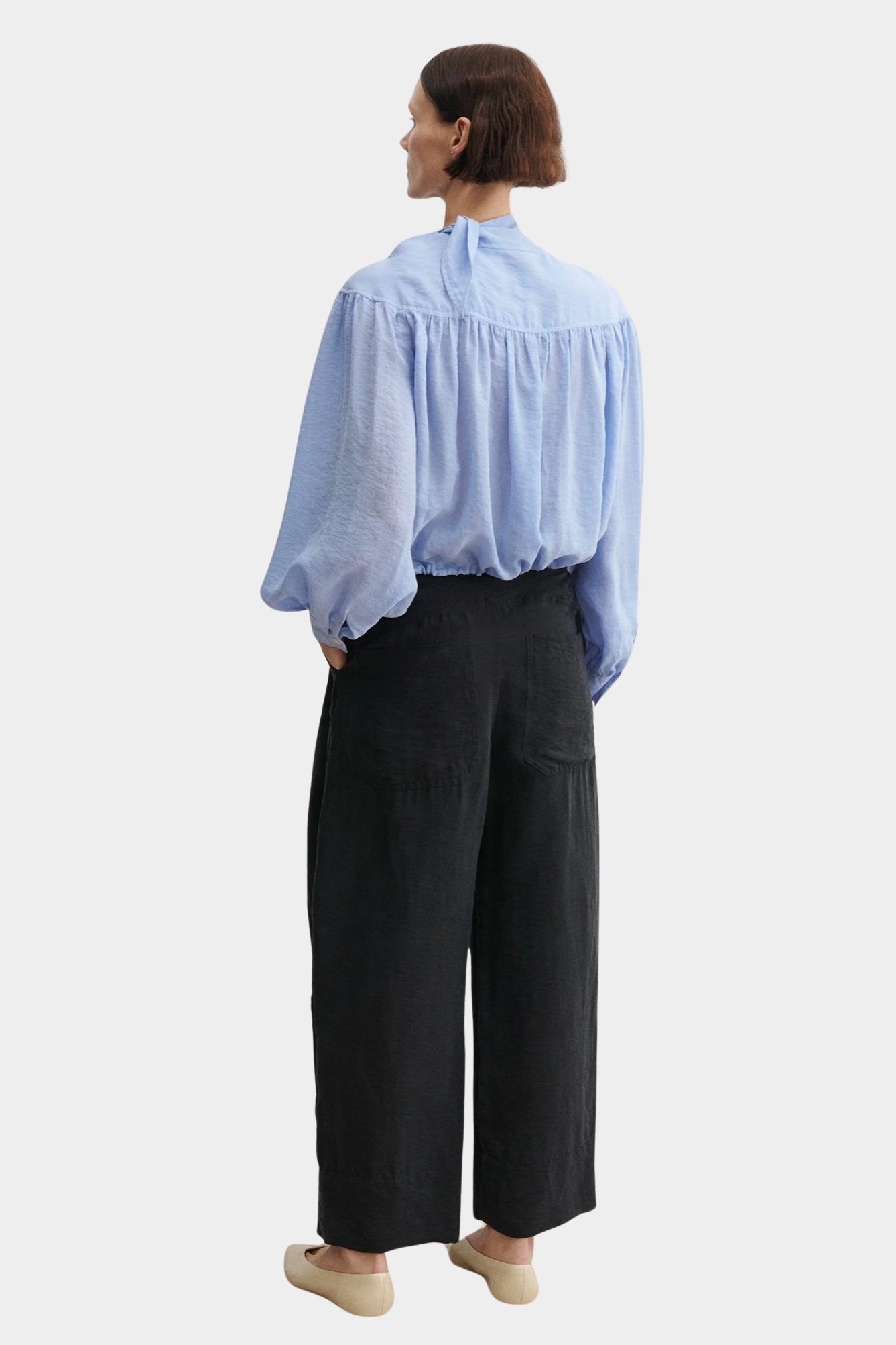 Rachel Comey Dini pant in black, back view highlighting relaxed fit and elastic waistband
