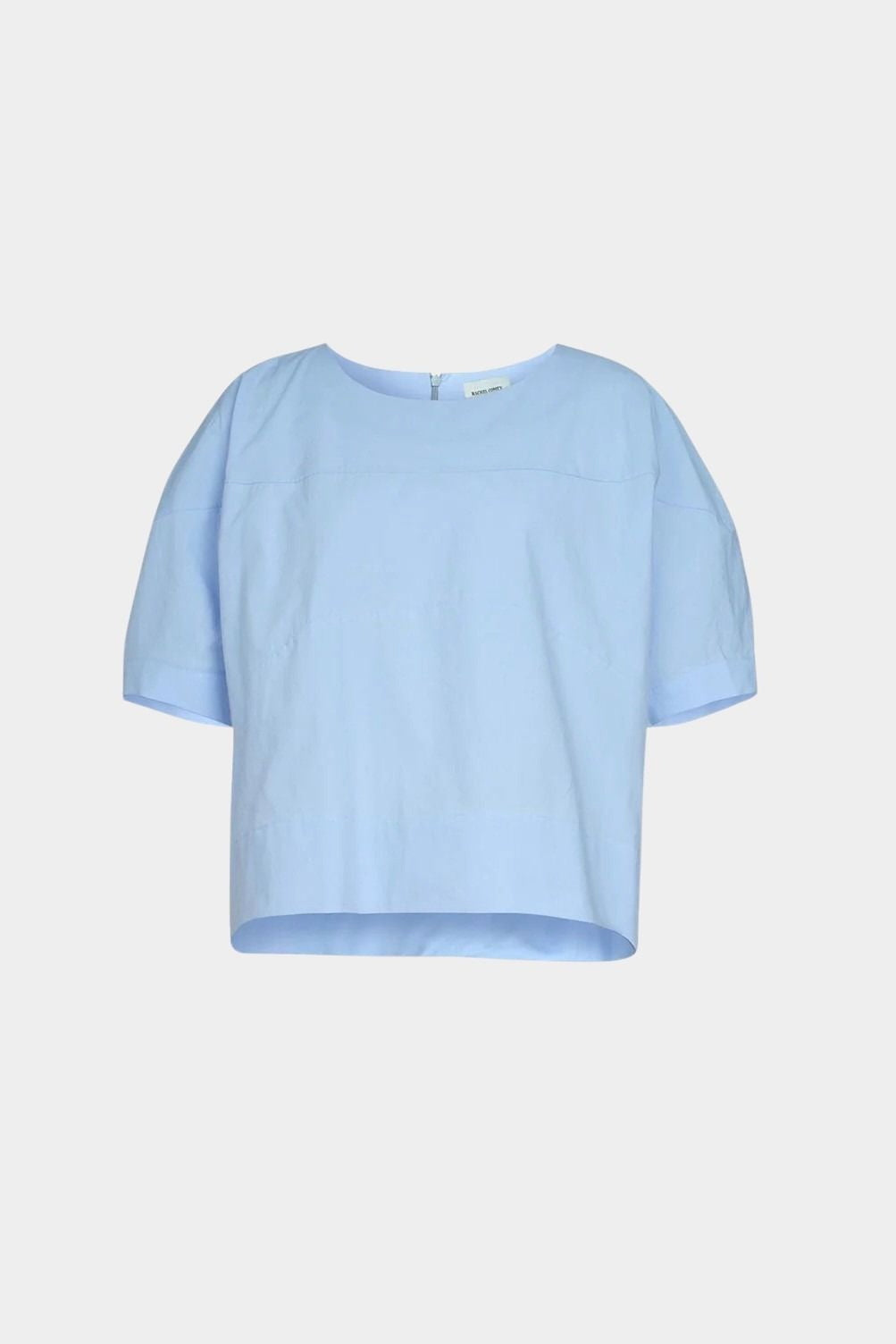 Rachel Comey rugby top in light blue cotton, flat lay showing clean neckline, soft structure, and cropped silhouette