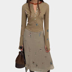 Rodebjer Kiara Henley top beige multi duchess floral print, full look with long sleeve fitted silhouette styled with matching midi skirt and boots