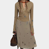 Rodebjer Kiara Henley top beige multi duchess floral print, full look with long sleeve fitted silhouette styled with matching midi skirt and boots