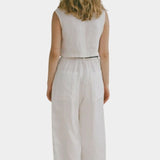 Shaina Mote Cielo linen top in natural back view with cropped sleeveless fit and straight hem