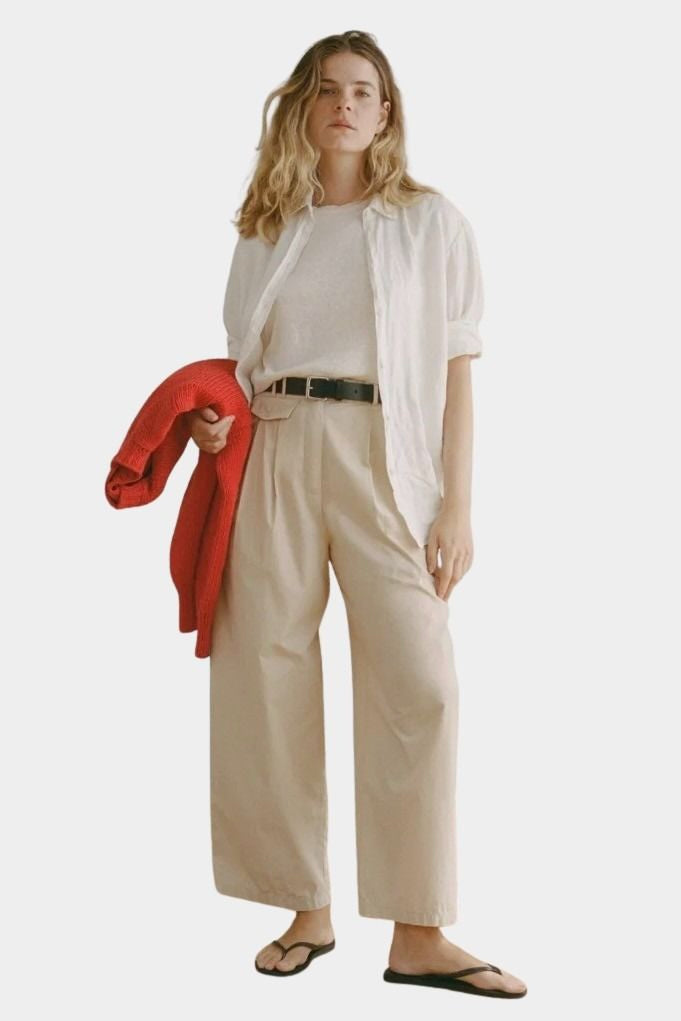 Shaina Mote Summer Chino Beige styled look relaxed wide leg chinos with white shirt and knit sweater
