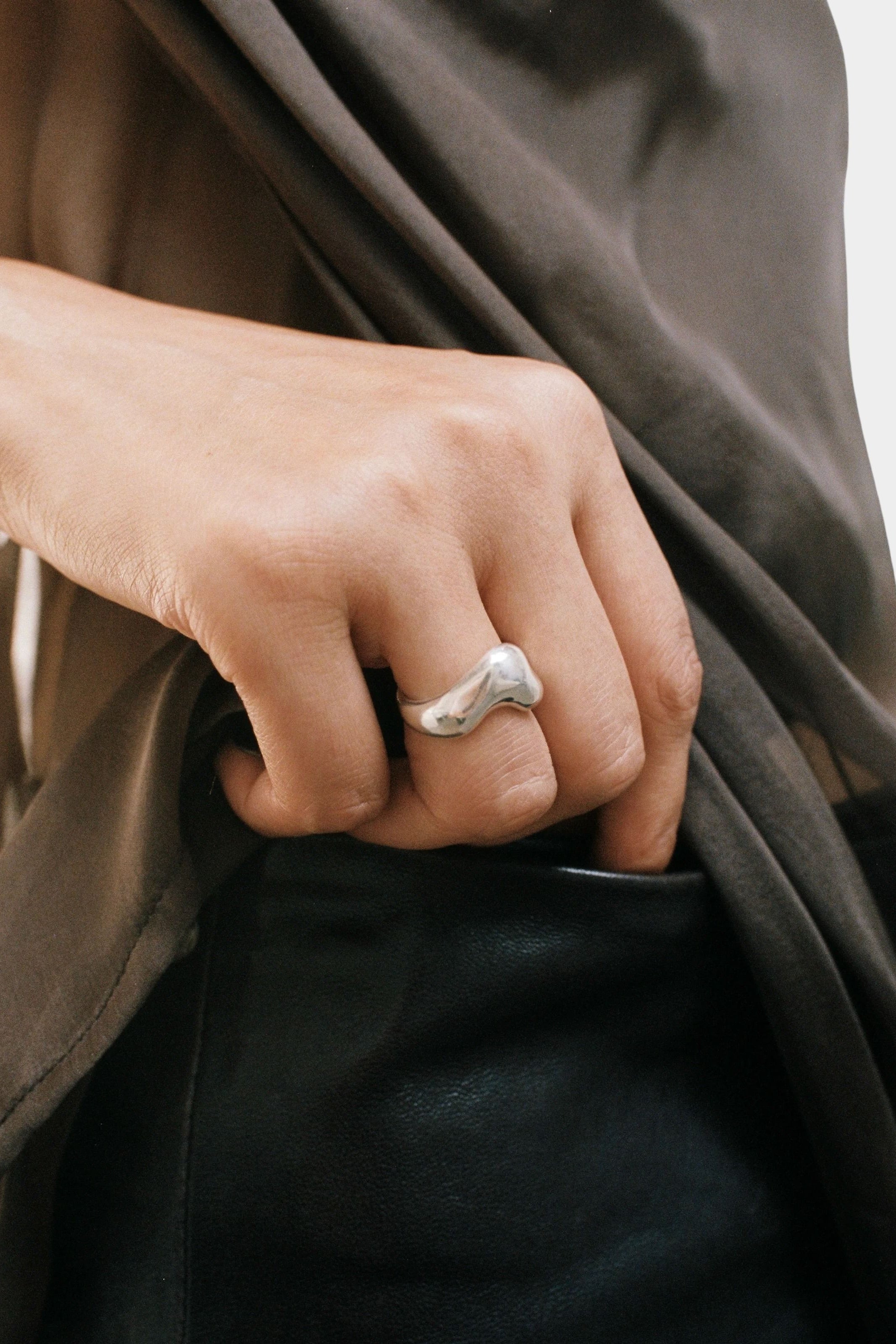 Bean Ring Sterling Silver Wolf Circus hand in pocket lifestyle silver ring