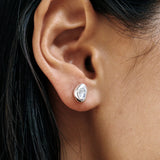 Bean Stud Earrings Sterling Silver Wolf Circus worn on ear close up sculptural silver stud earrings