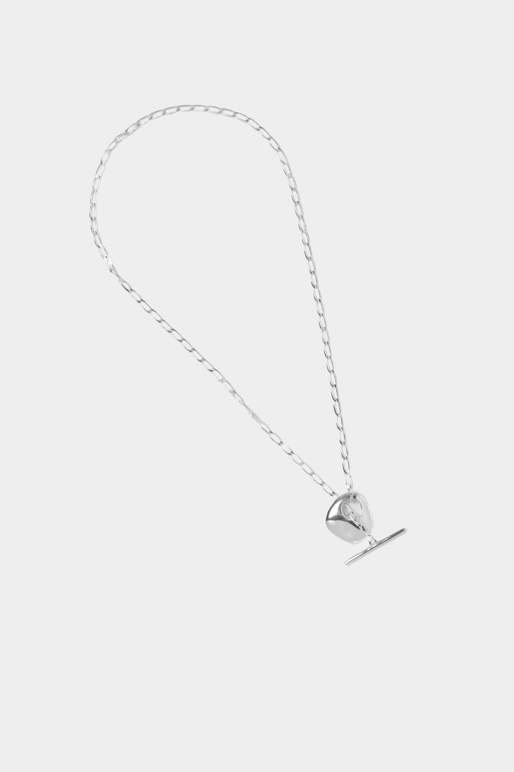 Wolf Circus Kaia necklace sterling silver curb chain toggle flat lay minimal background